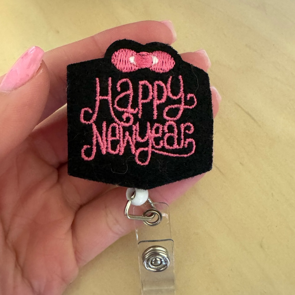 Pink 'Happy New Year' Embroidered Badge Reel